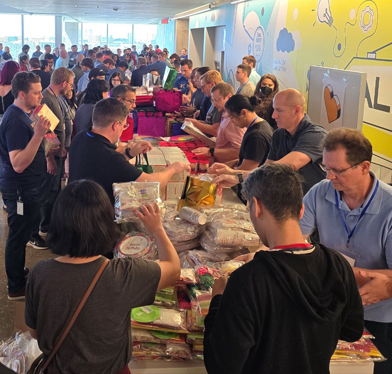 Alkami’s technology division gathers for our annual TechFin Hackathon, during their time together they packed donation bags for Minnie’s Food Pantry.